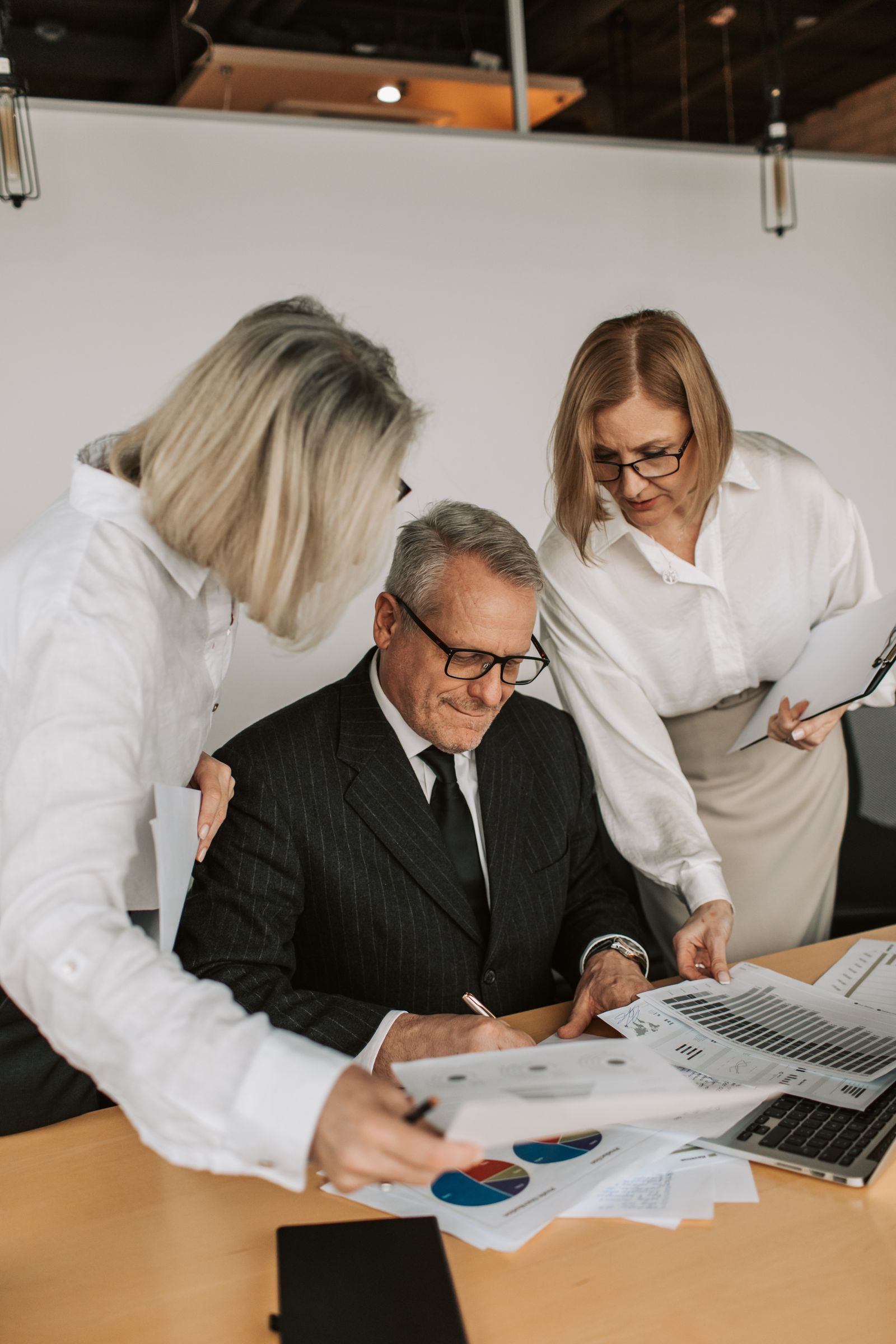 Business professionals reviewing contractor credentials